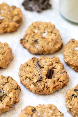 Vegan oatmeal chocolate chip cookies with sea salt sprinkled on top.