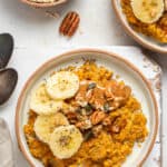 bowl of pumpkin oats with banana and nut butter