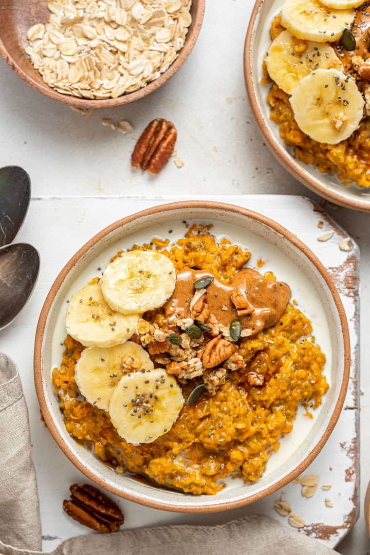 bowl of pumpkin oats with banana and nut butter