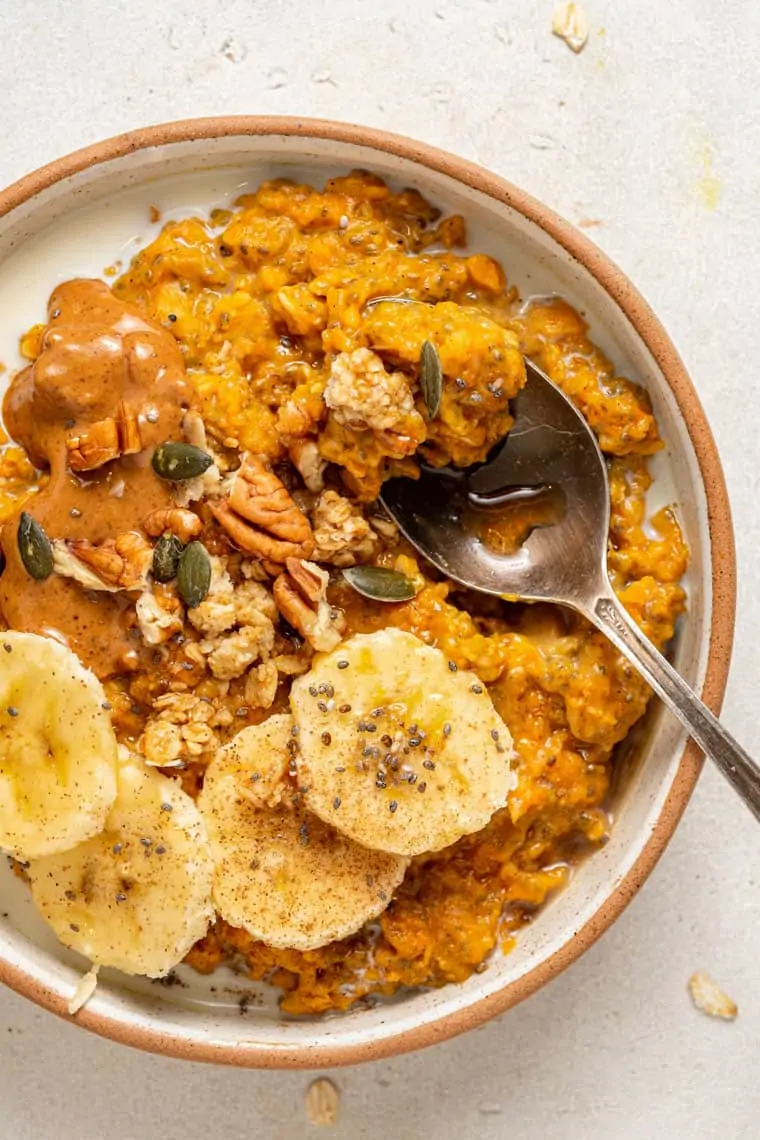 close up on pumpkin oatmeal with banana