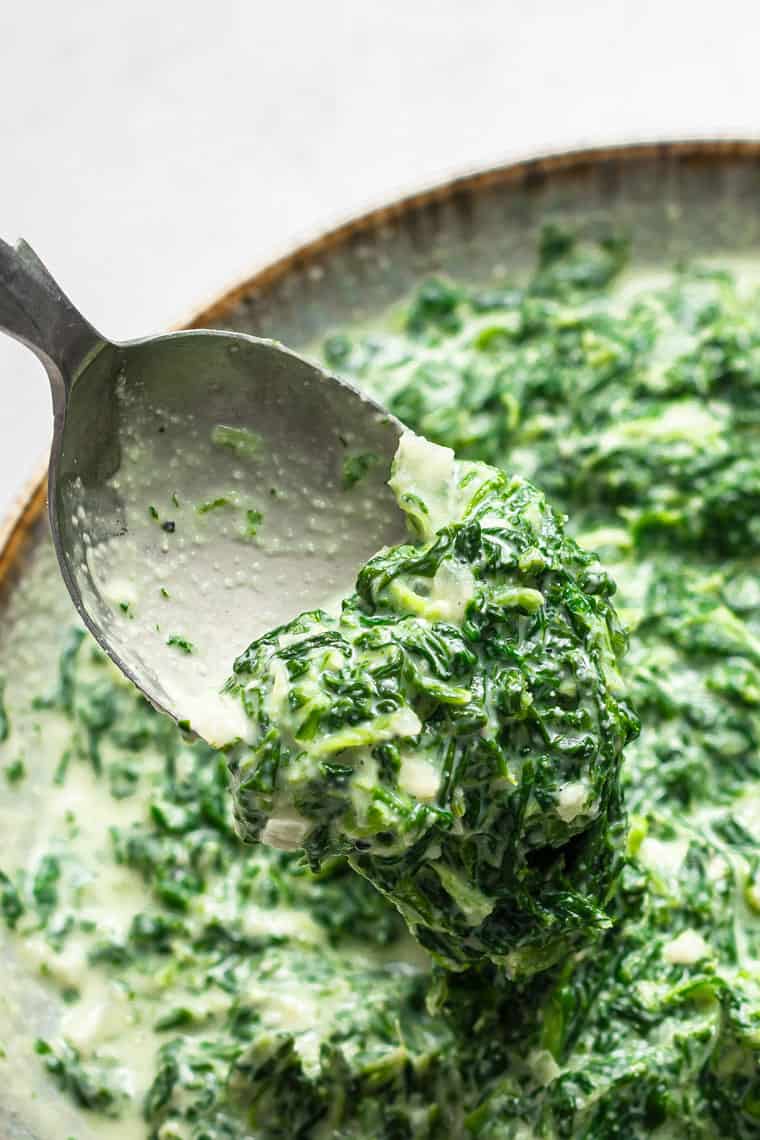 spoon of creamed vegan spinach