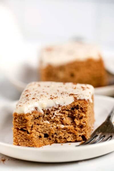 Healthy apple cake slice on plate with corner eaten