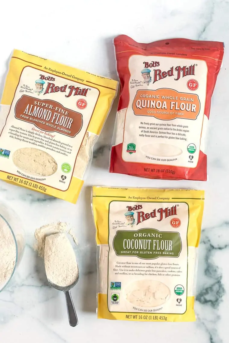 Bags of three types of flours needed for gluten-free apple cake.