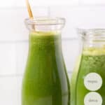 glass of green juice with straw