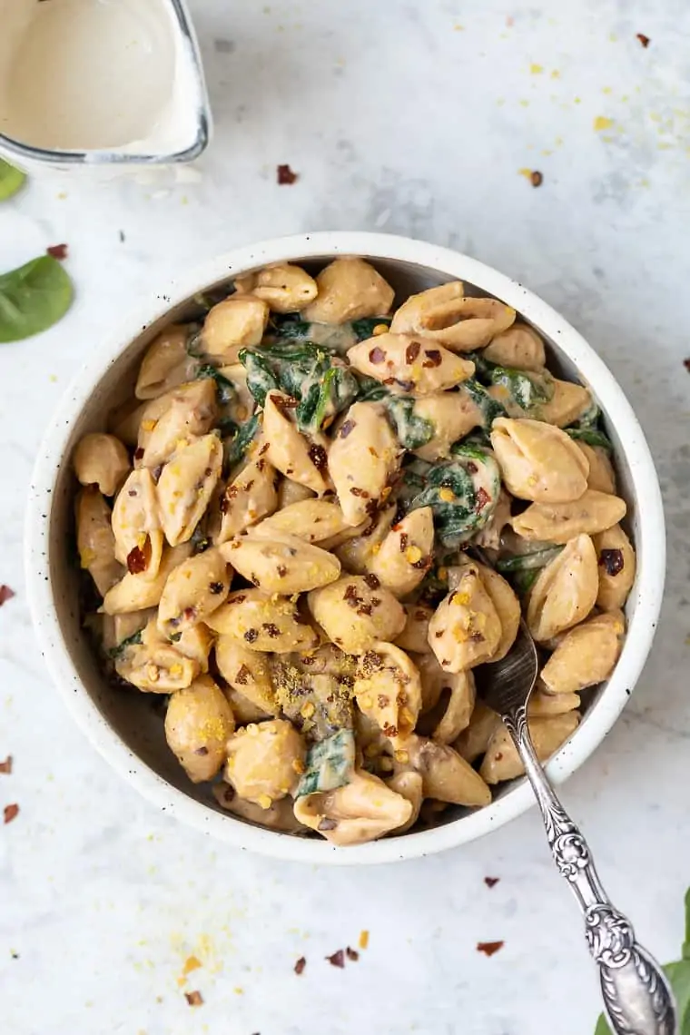 vegan creamy sun dried tomato pasta with spinach