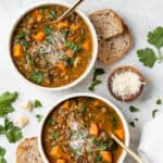 two bowls of vegetarian lentil soup with sweet potatoes