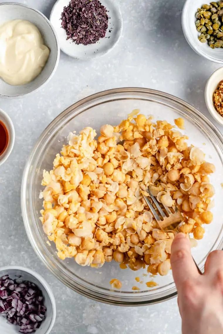 making chickpea tuna in a bowl mashing with a fork