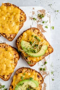 slice of chickpea tuna melt served with a slice of avocado