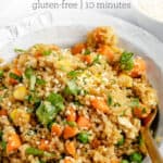 bowl of easy quinoa fried rice from the side with sesame seeds on top