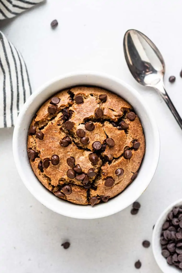 overhead of white bowl with blended baked oatmeal and chocolate chips