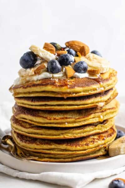 stack of protein pancakes with yogurt, berries and almonds