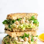 side view of two chickpea caesar salad sandwiches on toast