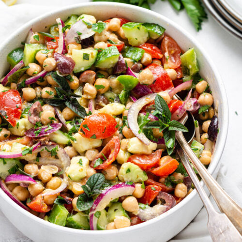 bowl of colorful chickpea and vegetable salad with dijon dressing