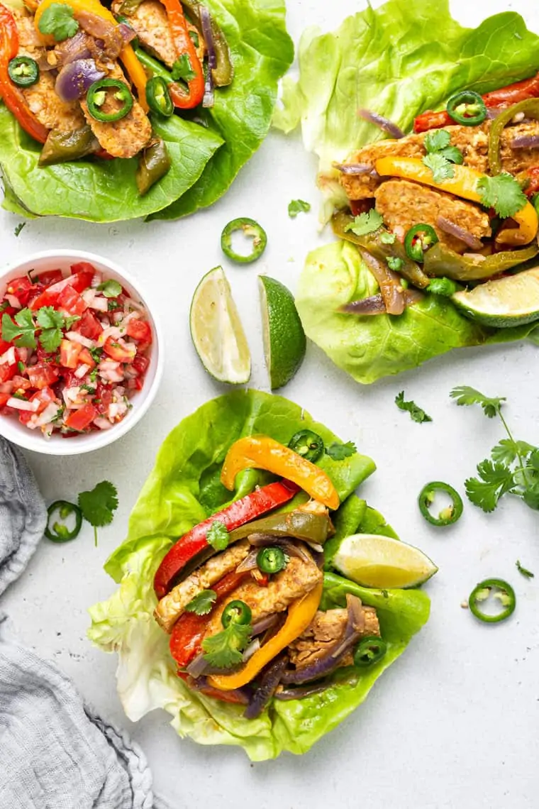 overhead of lettuce wraps with vegan tempeh fajita filling