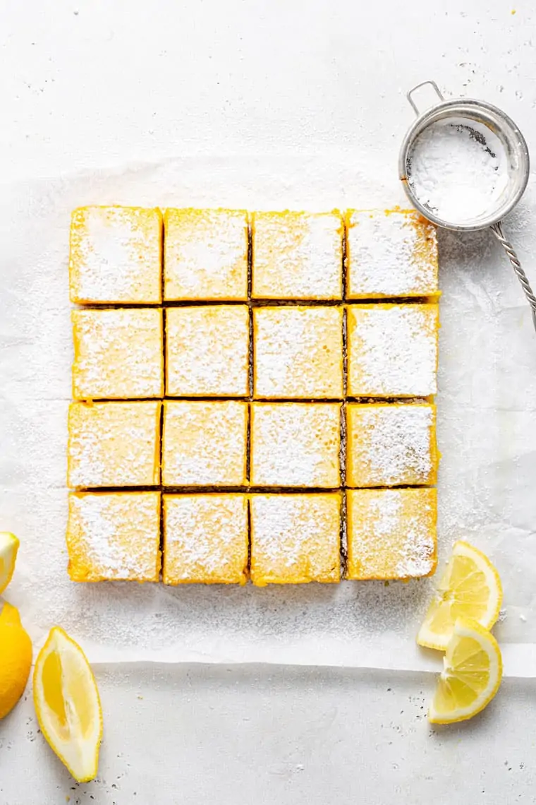 overhead of a tray of lemon bars topped with powdered sugar