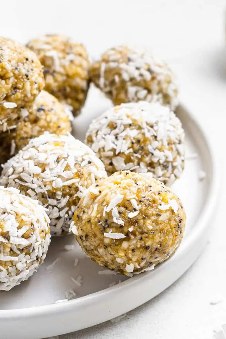 close up on a vegan energy bite with coconut shavings