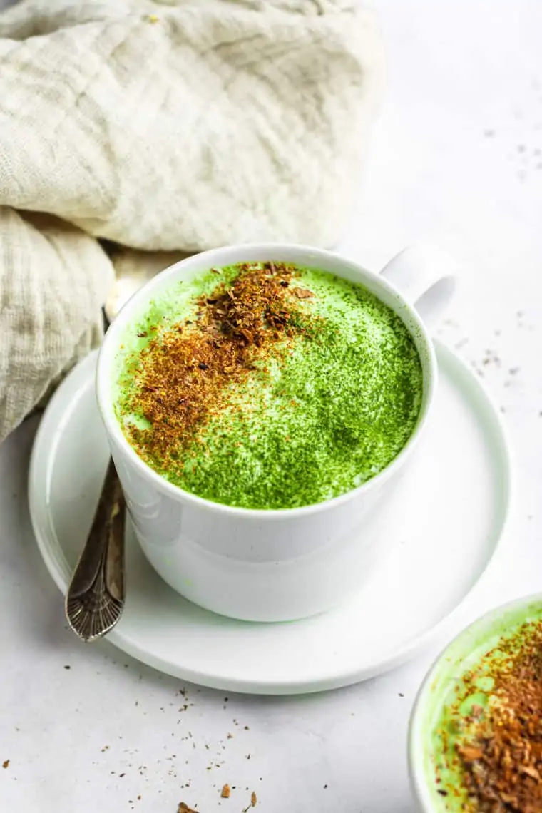 saucer and mug of pumpkin spice matcha latte