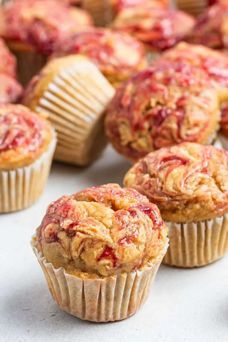 close up of mini muffin with peanut butter & jelly swirl on top