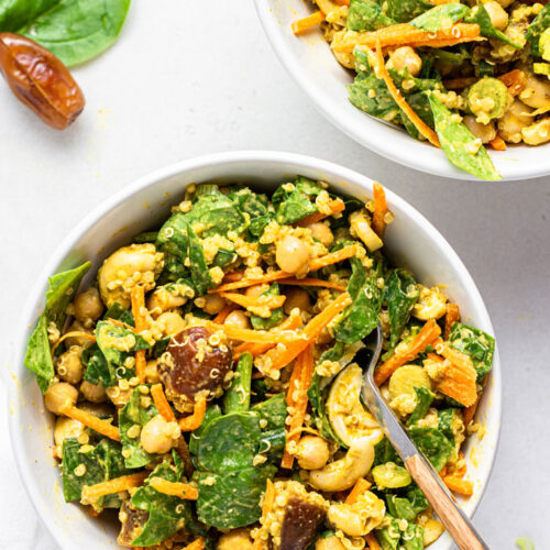 two white bowls of spicy moroccan quinoa salad