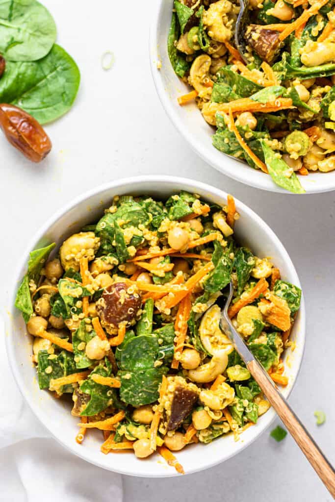 two white bowls of spicy moroccan quinoa salad