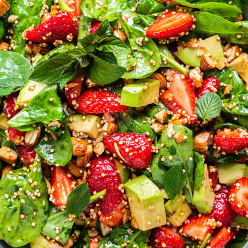 close up on strawberry salad with quinoa and spinach