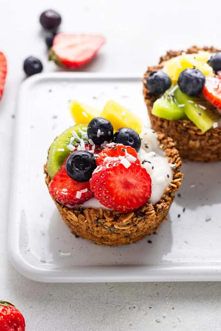 close up on a granola cup with fresh berries and yogurt