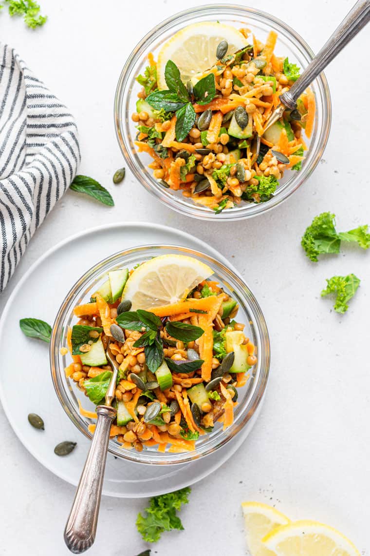overhead of curried lentil salad with carrots and lemon