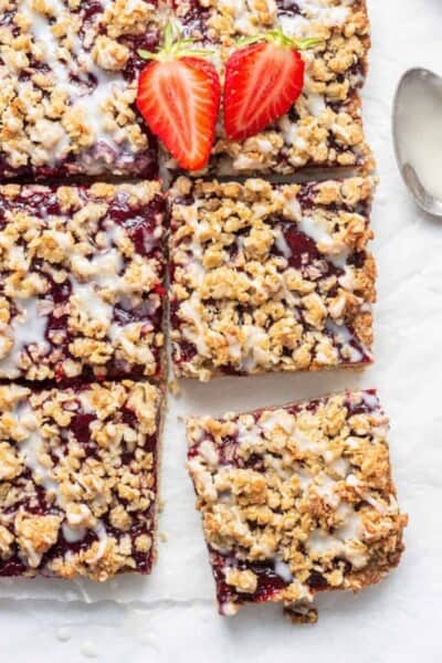 six slices of oatmeal bars with fresh strawberries