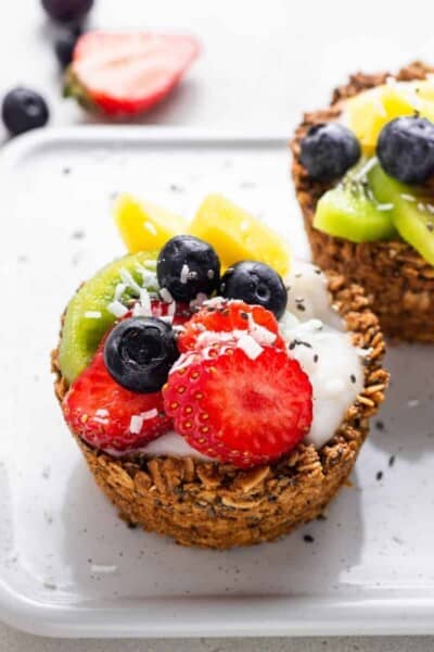 close up of vegan granola cups with fresh fruit and coconut yogurt