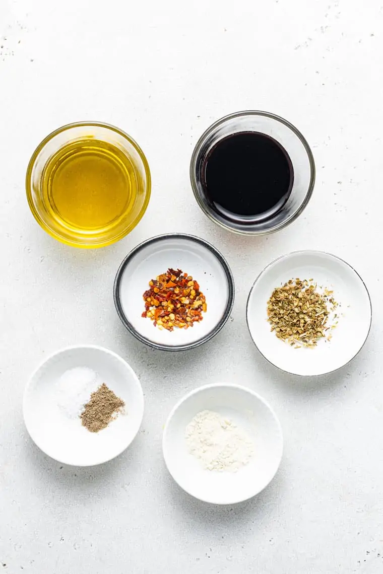 overhead of the ingredients for easy balsamic marinade in small bowls