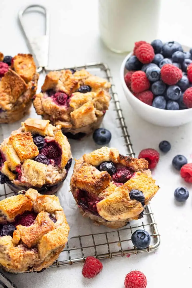 wire rack wth french toast cups and fresh berries on top