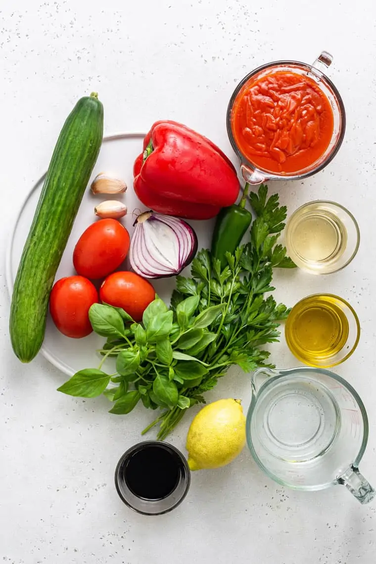 ingredients for spicy gazpacho cucumber, tomato, onion and lemon