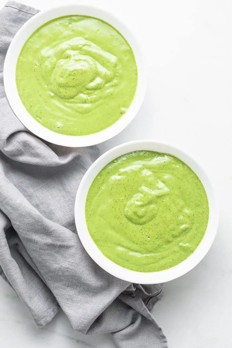 two green smoothie bowls with no toppings