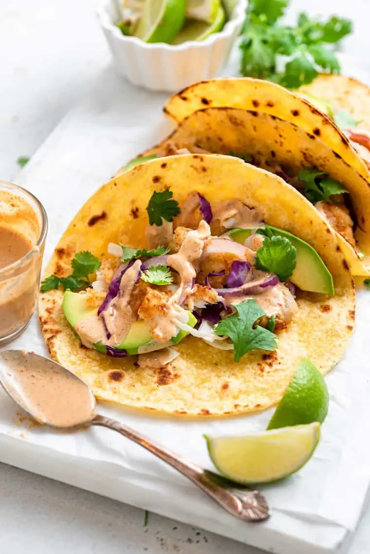 close up on a taco with crispy fish and tahini sauce