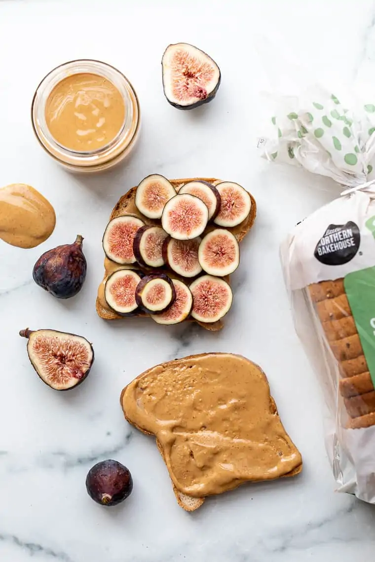 slices of bread with peanut butter and fresh fig slices
