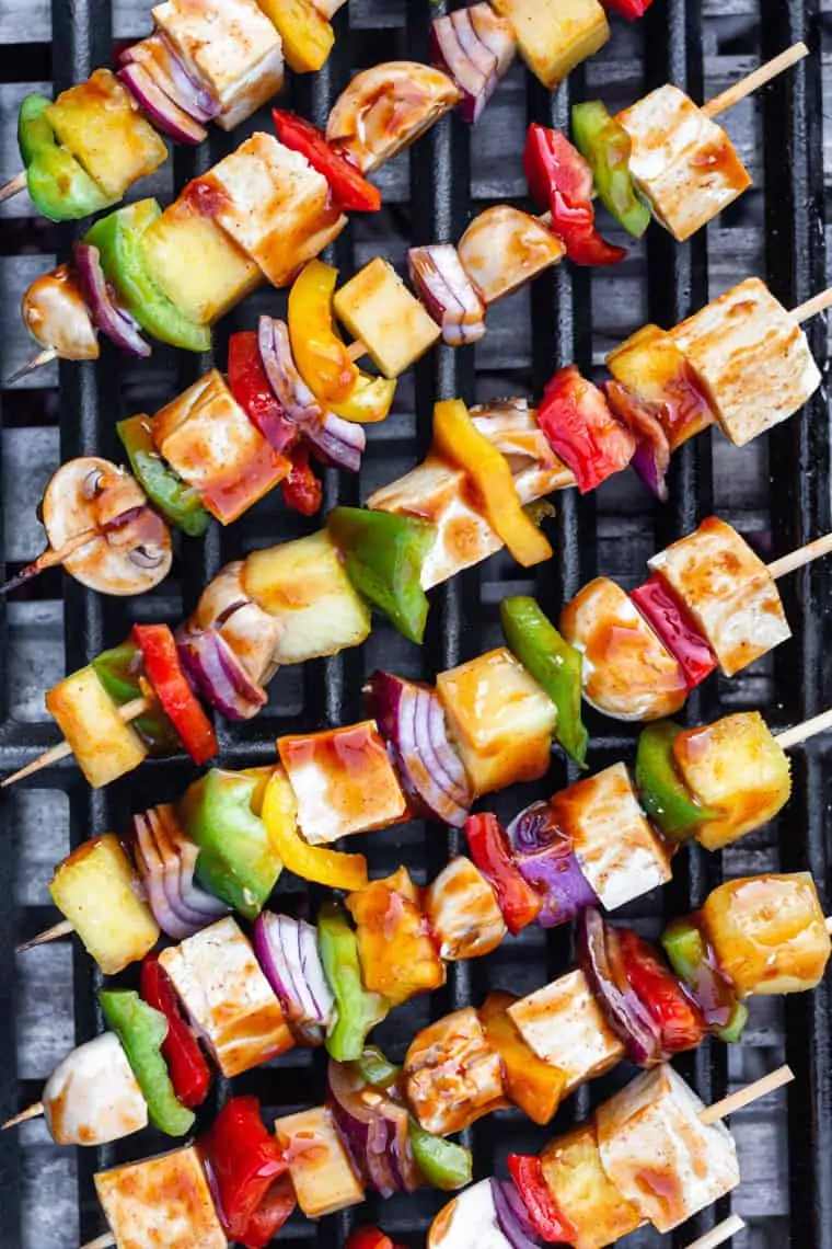 grill with pineapple, coconut and pepper skewers in barbecue sauce