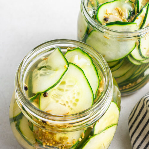two jars of thinly sliced pickled cucumbers