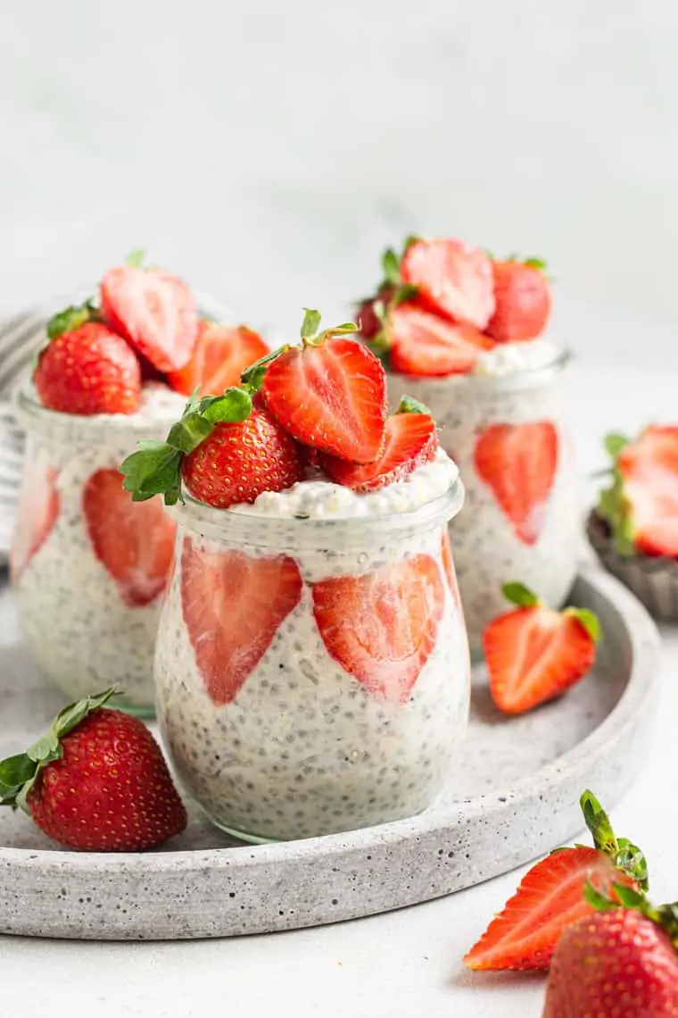 close up on a jar of strawberry and quinoa overnight oats with fresh berries