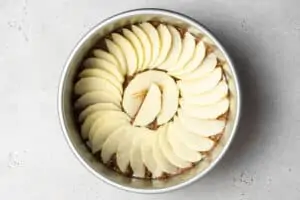 unbaked apple cake in a pan