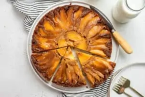 slices of upside-down apple cake on a serving platter