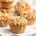 stacks of apple cinnamon muffins on wooden board