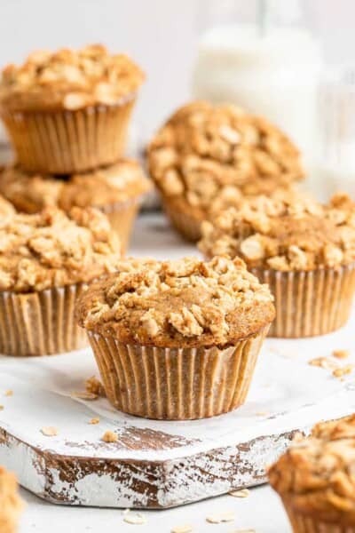 stacks of apple cinnamon muffins on wooden board