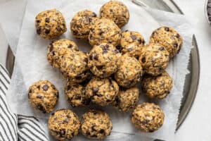 peanut butter energy balls on a piece of parchment paper