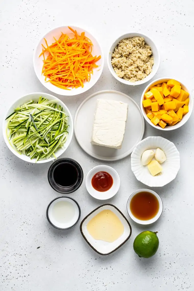 ingredients for bowls with quinoa, carrots, tofu and zucchini