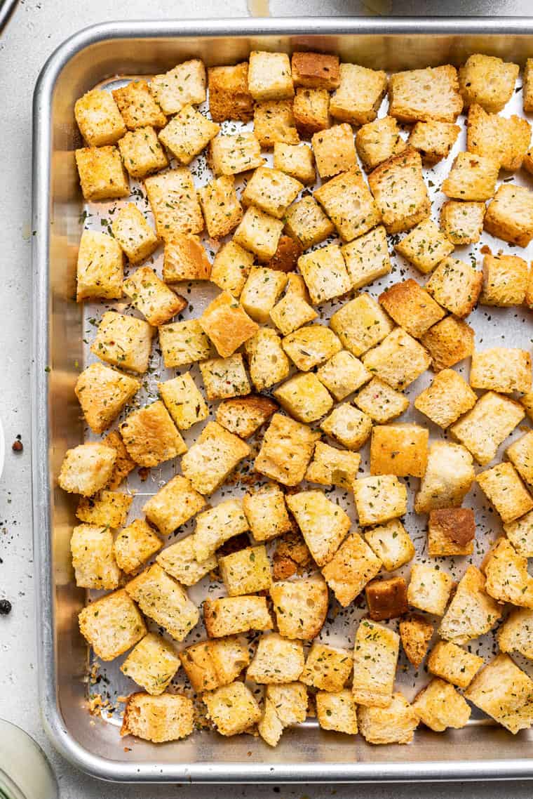 overhead of a baking sheet with croutons