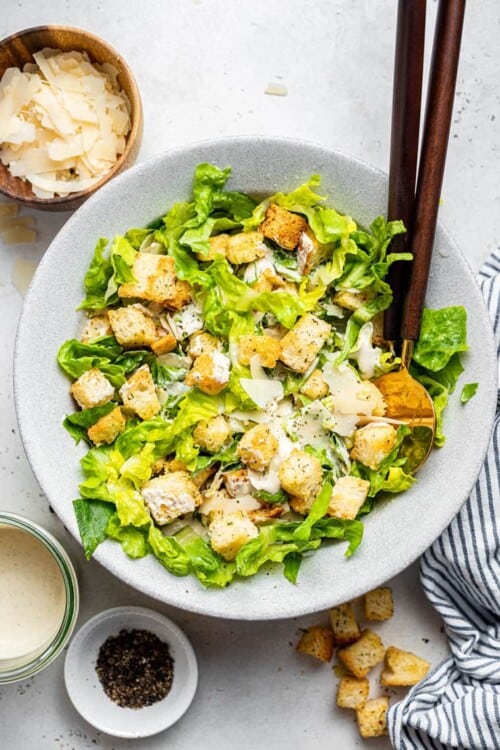 overhead of a bowlof vegan caesar salad with romaine and croutons