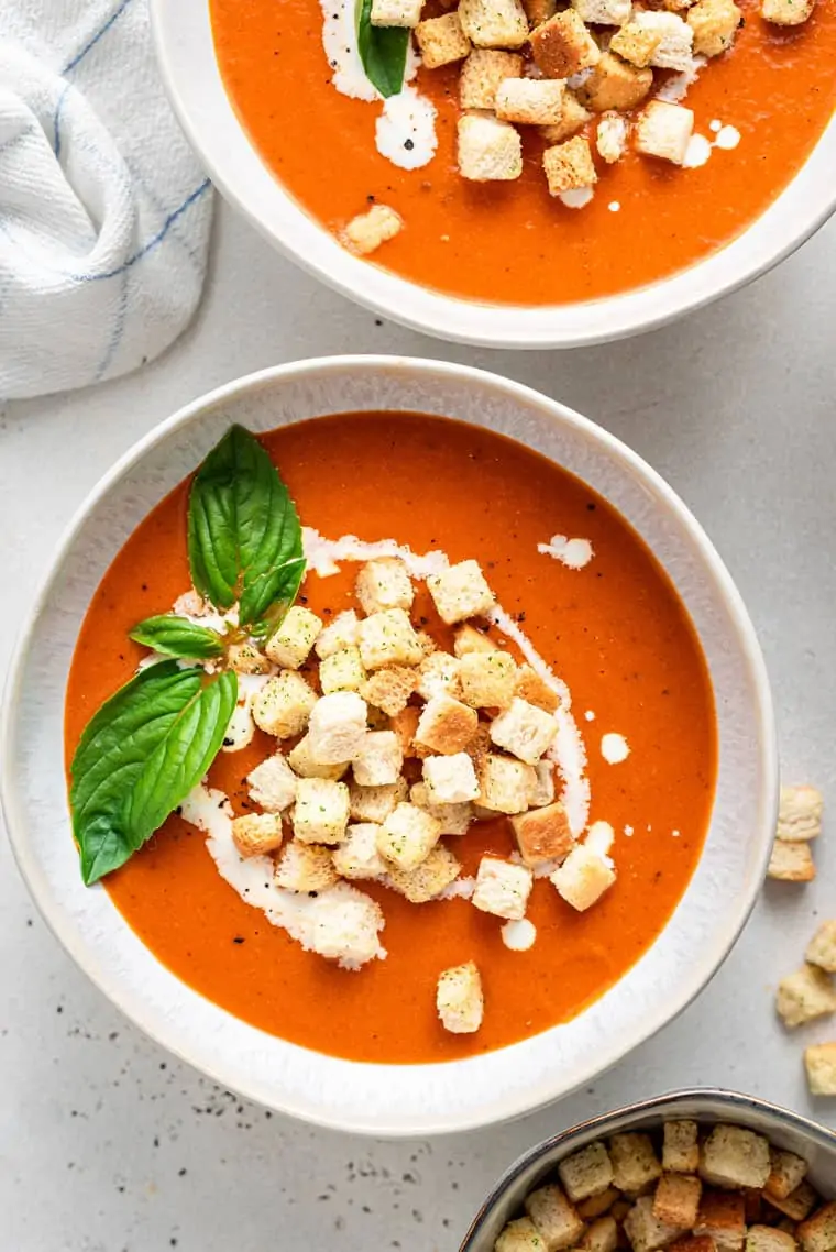 bowl of vegan tomato soup with croutons