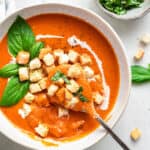 bowl of creamy tomato soup with croutons