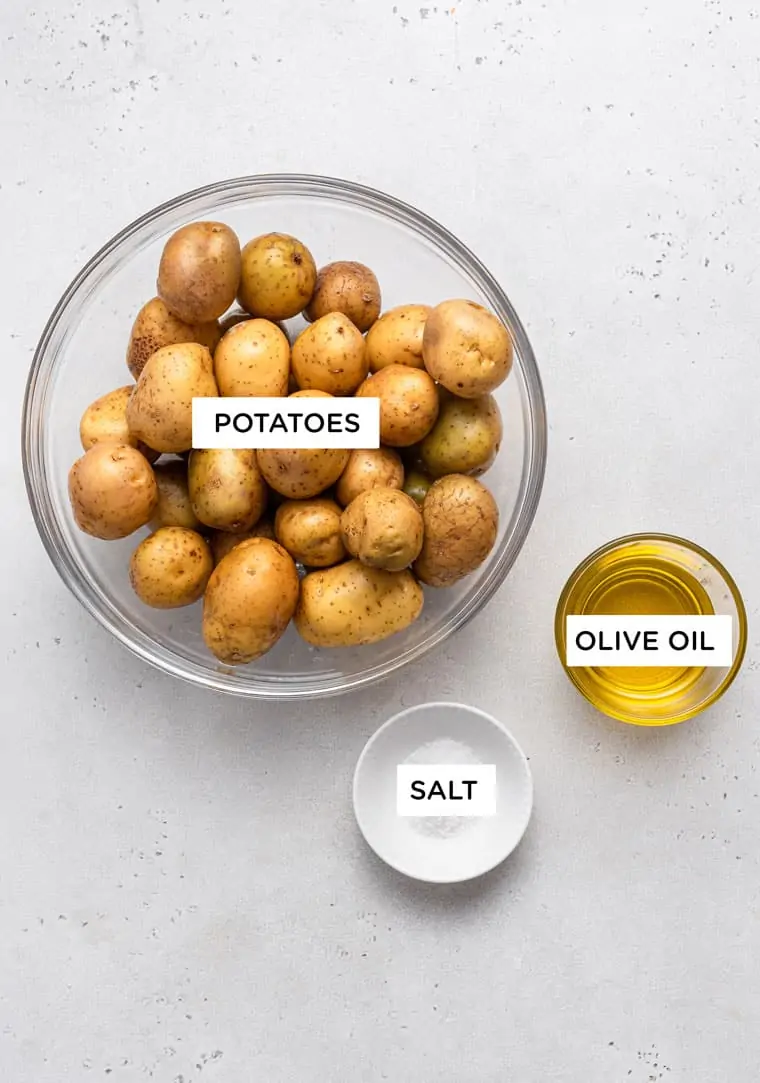 bowl of whole potatoes, olive oil and salt