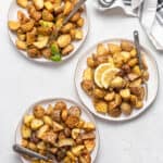 three plates of roasted potatoes